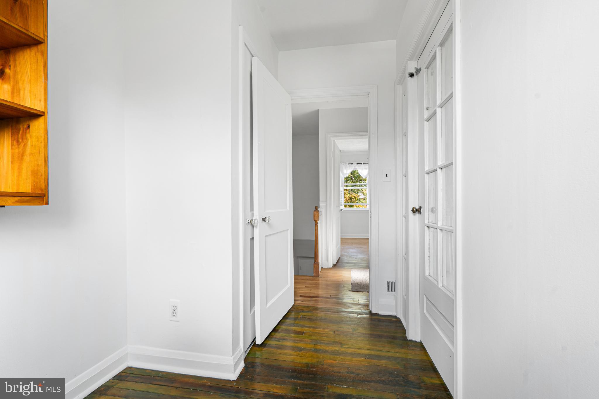 3454 McShane Way Baltimore, MD 21222 - Photo 14 of 35 a view of a hallway with wooden floor and a bathroom