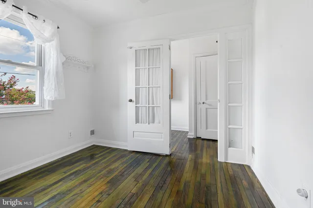 a bed room with a bed and a television