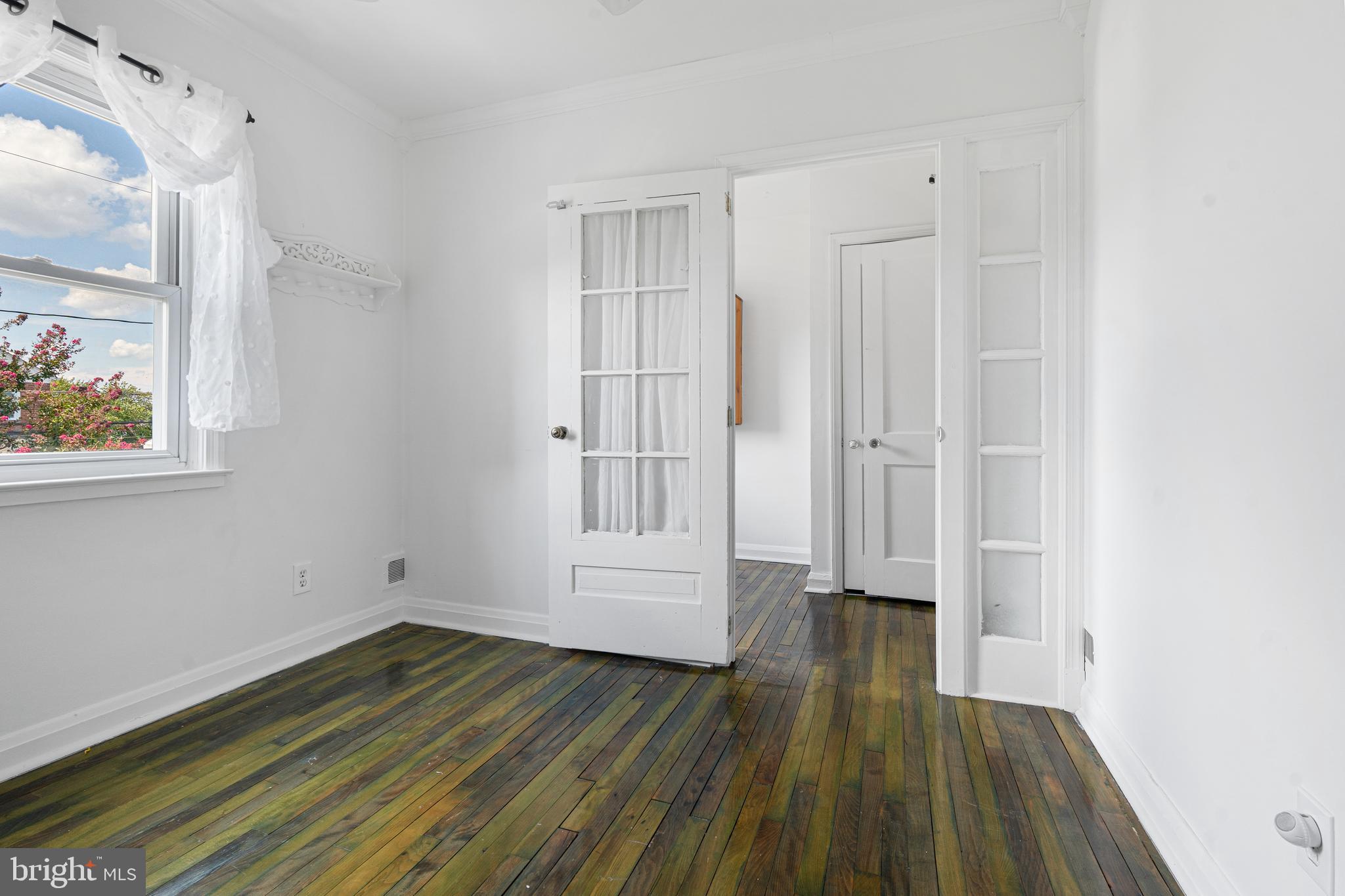 3454 McShane Way Baltimore, MD 21222 - Photo 16 of 35 a view of empty room with wooden floor and fan