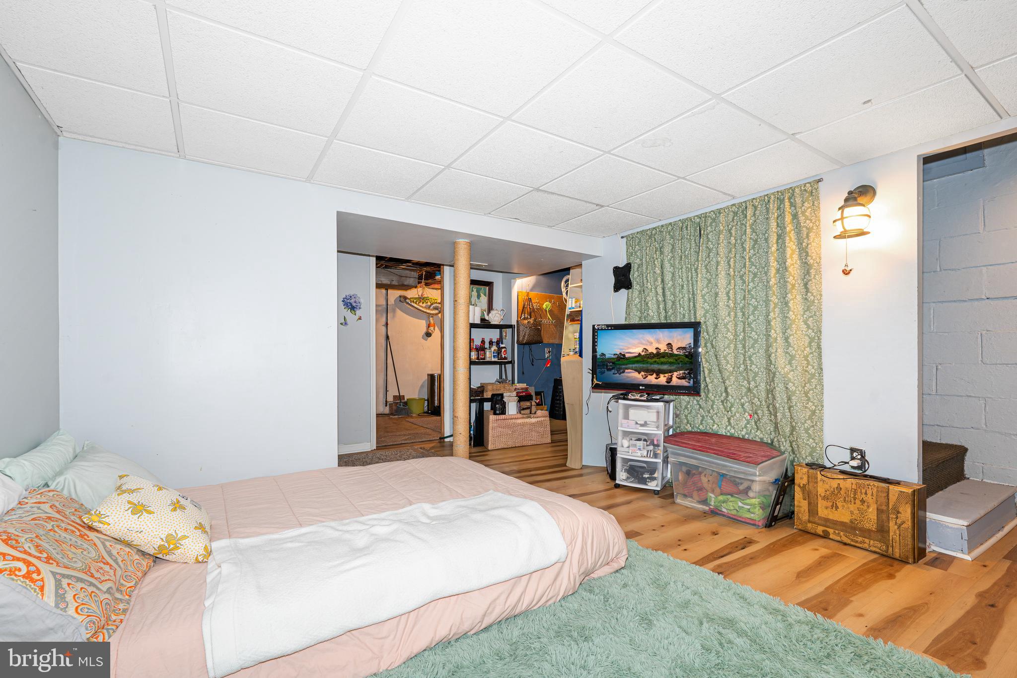 3454 McShane Way Baltimore, MD 21222 - Photo 17 of 35 a bed room with a bed and a television