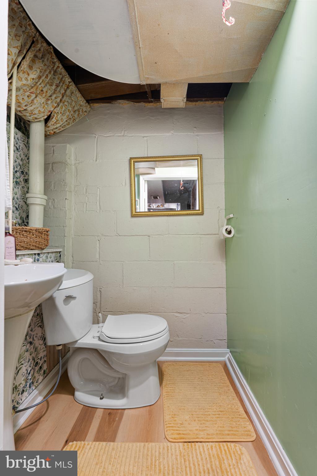 3454 McShane Way Baltimore, MD 21222 - Photo 21 of 35 a bathroom with a toilet and a shower