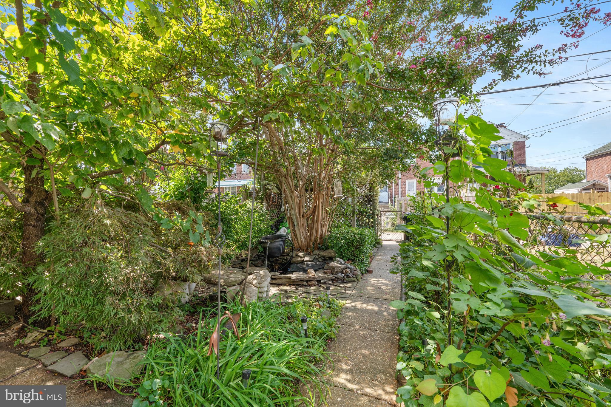 3454 McShane Way Baltimore, MD 21222 - Photo 22 of 35 a view of a green field with lots of bushes