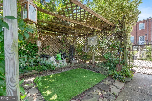 a view of a pathway both side of the house