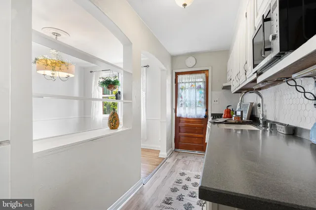 a kitchen with stainless steel appliances granite countertop a refrigerator and a stove