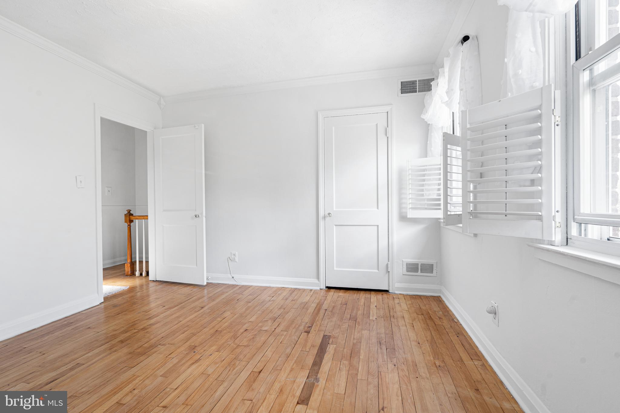 3454 McShane Way Baltimore, MD 21222 - Photo 10 of 35 wooden floor in an empty room with a window