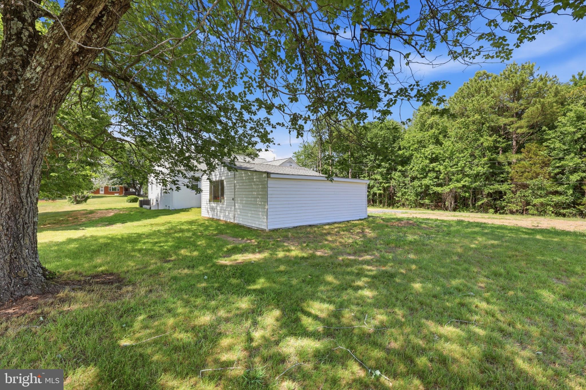 8251 Marshall Corner Road Pomfret, MD 20675 - Photo 20 of 20 Charming home nestled in lush greenery.