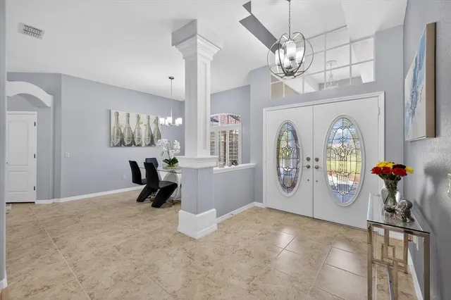 a bedroom with a large bed and a flat screen tv