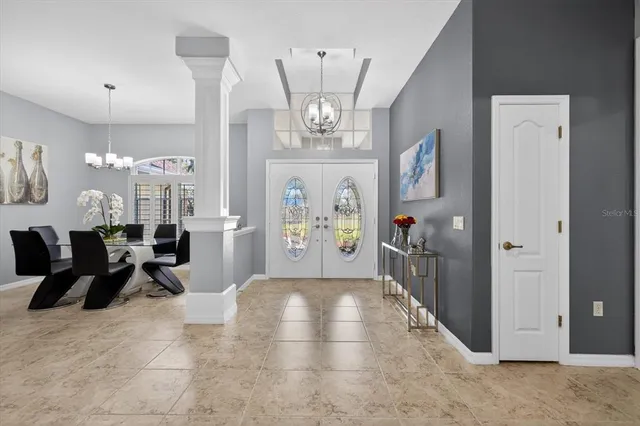 a bedroom with a large bed and a flat screen tv