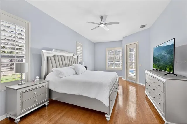 a bathroom with a sink vanity granite tub and a mirror