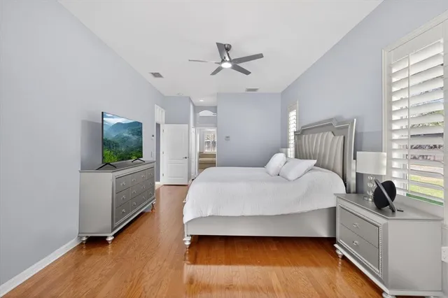 a bathroom with a tub shower and a sink
