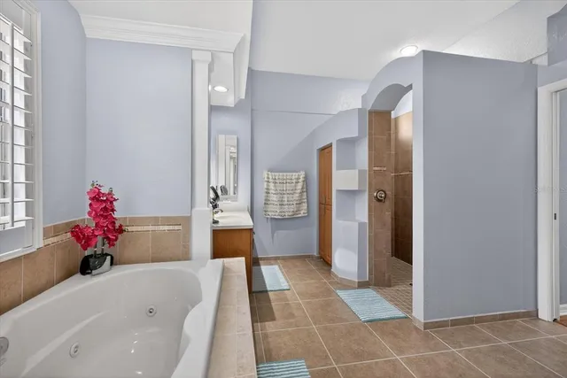 a view of a livingroom with furniture and a window