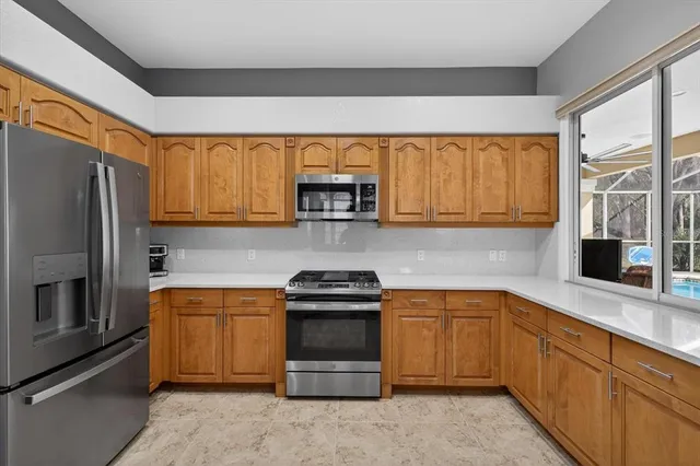 a bathroom with double vanity sinks and a mirror