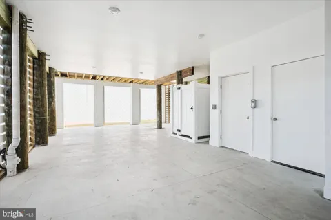 a view of a house with an empty space and a window