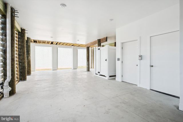 a view of a house with an empty space and a window