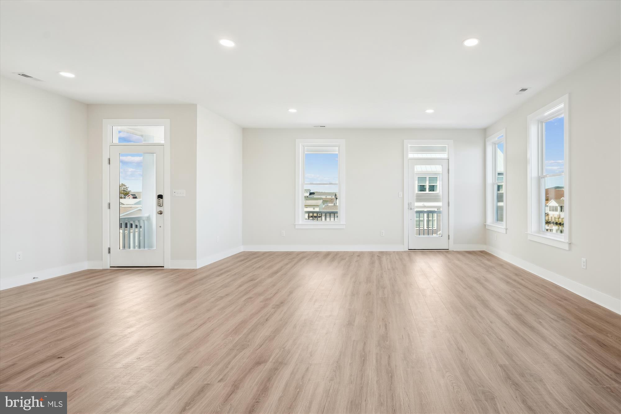 37926 Even Tide Lane Rehoboth Beach, DE 19971 - Photo 4 of 18 a view of an empty room with wooden floor and a window
