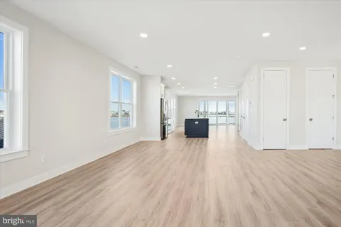 a view of kitchen with furniture and wooden floor