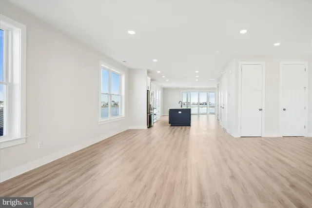 a view of kitchen with furniture and wooden floor