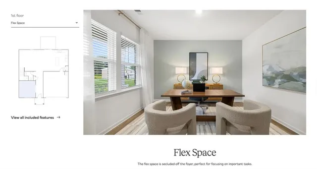 a living room with a bed furniture and a potted plant