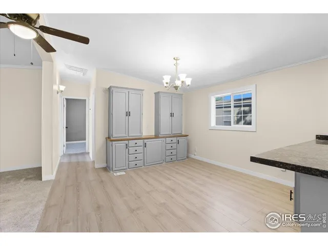 a bedroom with a bed and a lamp