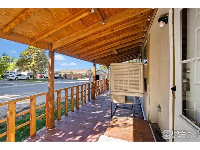a view of a patio with wooden floor