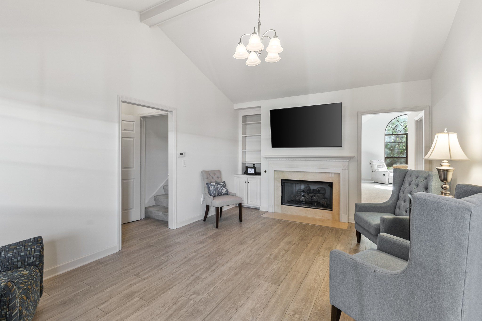 8090 Sunrise Circle Franklin, TN 37067 - Photo 16 of 57 a living room with furniture a fireplace and a flat screen tv