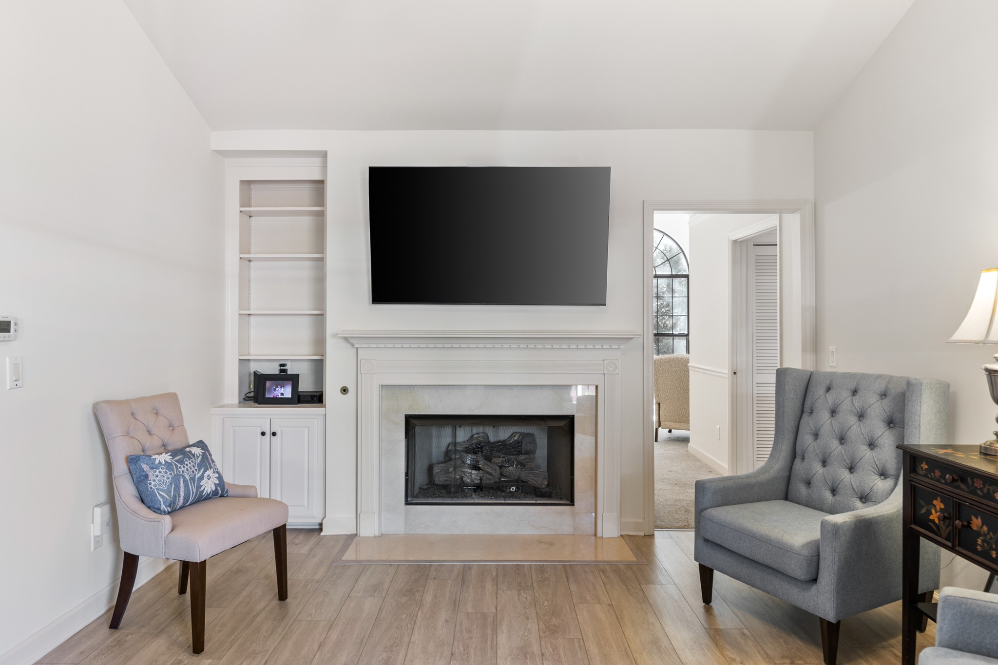 8090 Sunrise Circle Franklin, TN 37067 - Photo 17 of 57 a living room with furniture a fireplace and a flat screen tv