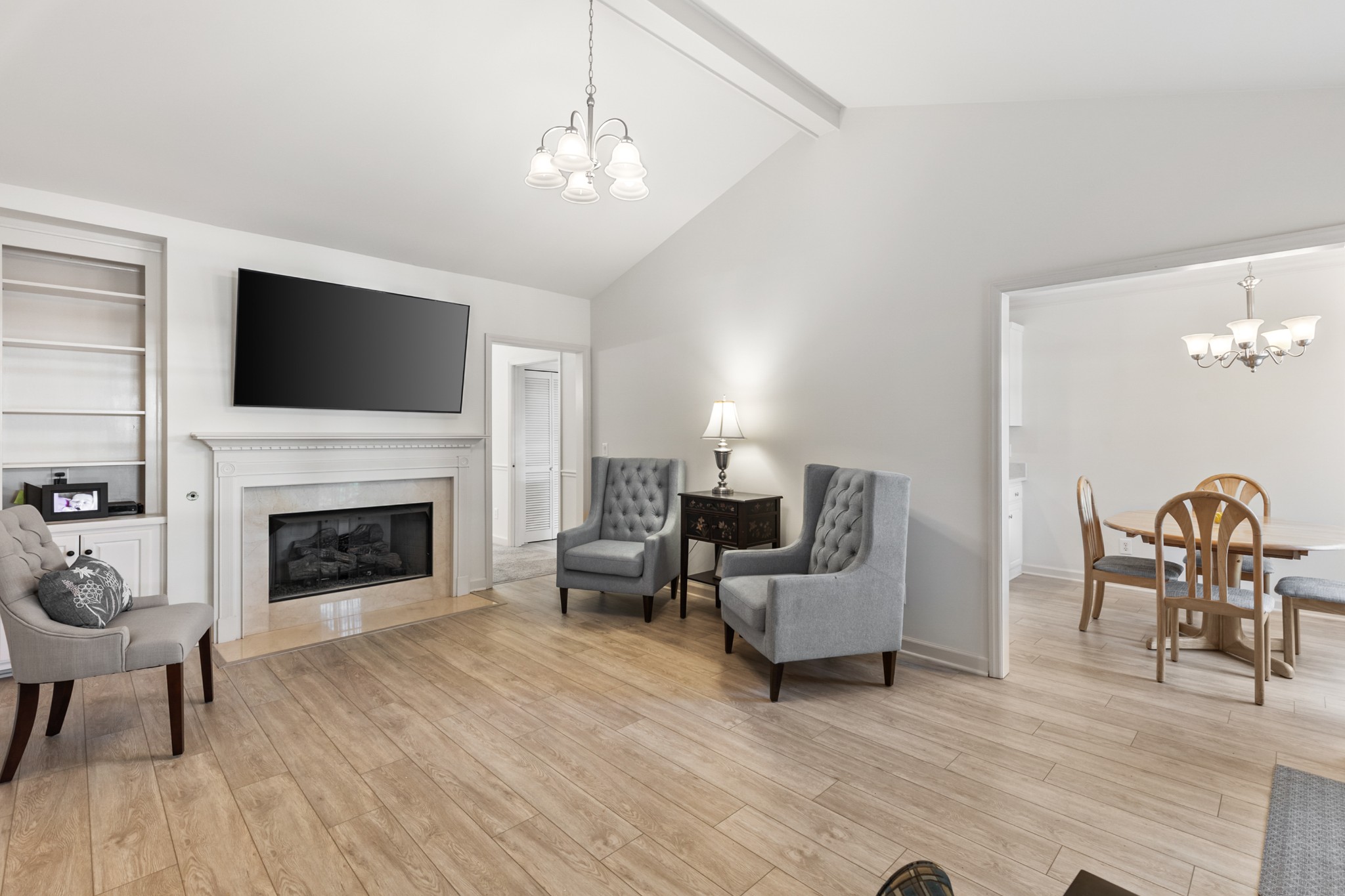 8090 Sunrise Circle Franklin, TN 37067 - Photo 18 of 57 a living room with furniture a fireplace and a flat screen tv