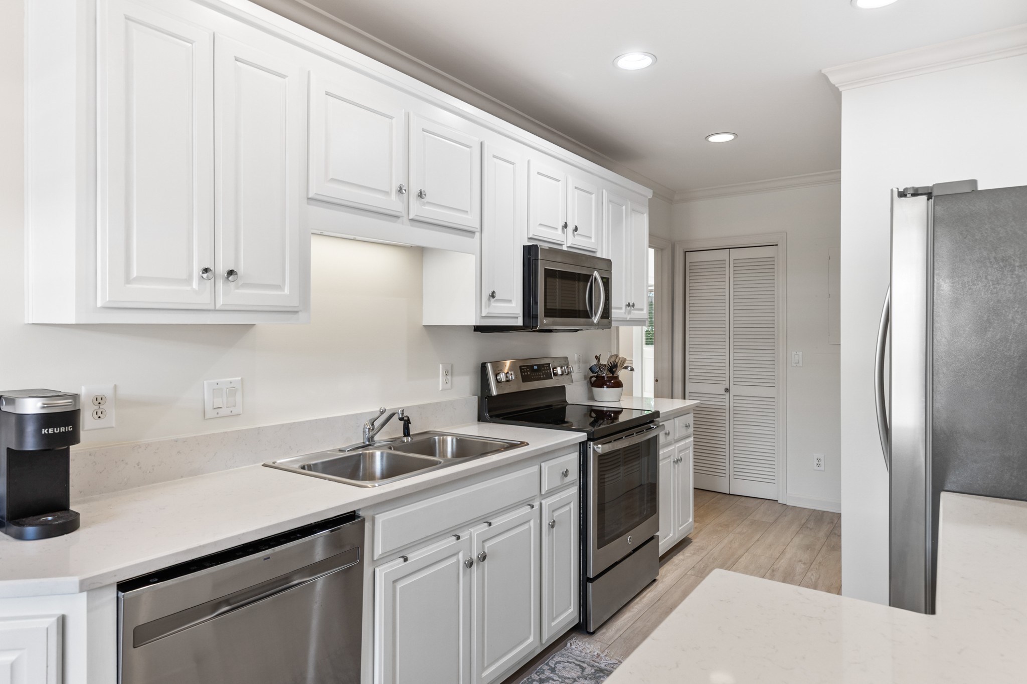 8090 Sunrise Circle Franklin, TN 37067 - Photo 22 of 57 a kitchen with cabinets stainless steel appliances and sink