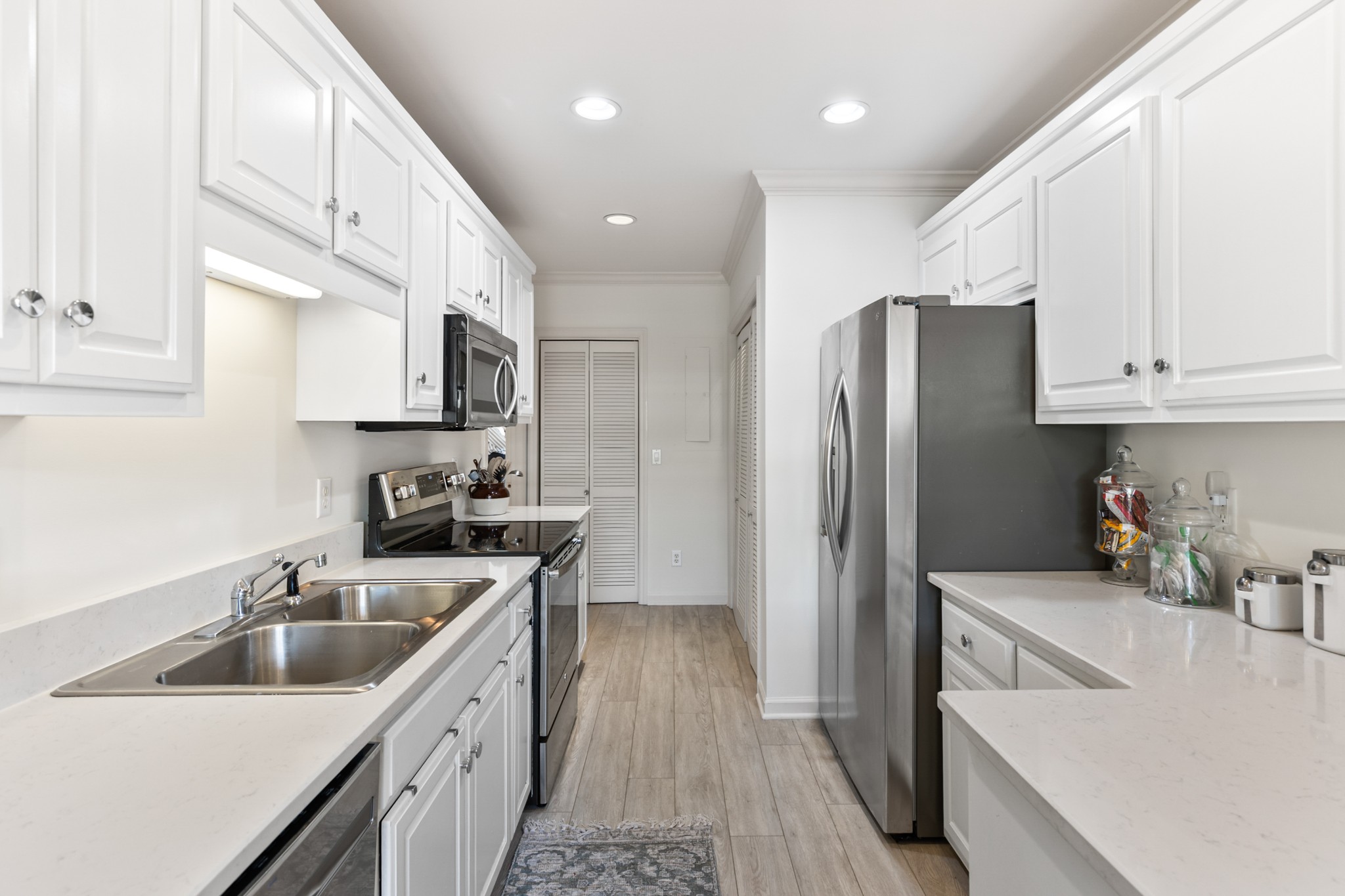 8090 Sunrise Circle Franklin, TN 37067 - Photo 23 of 57 a kitchen with stainless steel appliances granite countertop a sink stove and refrigerator