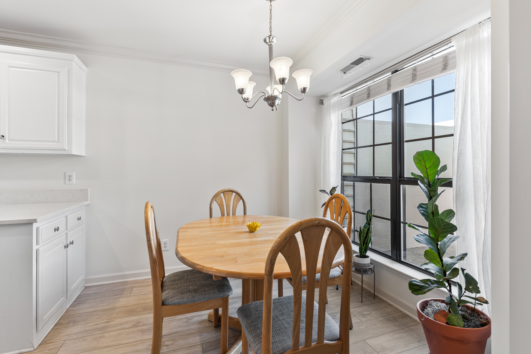 8090 Sunrise Circle Franklin, TN 37067 - Photo 26 of 57 a view of a dining room with furniture window and wooden floor