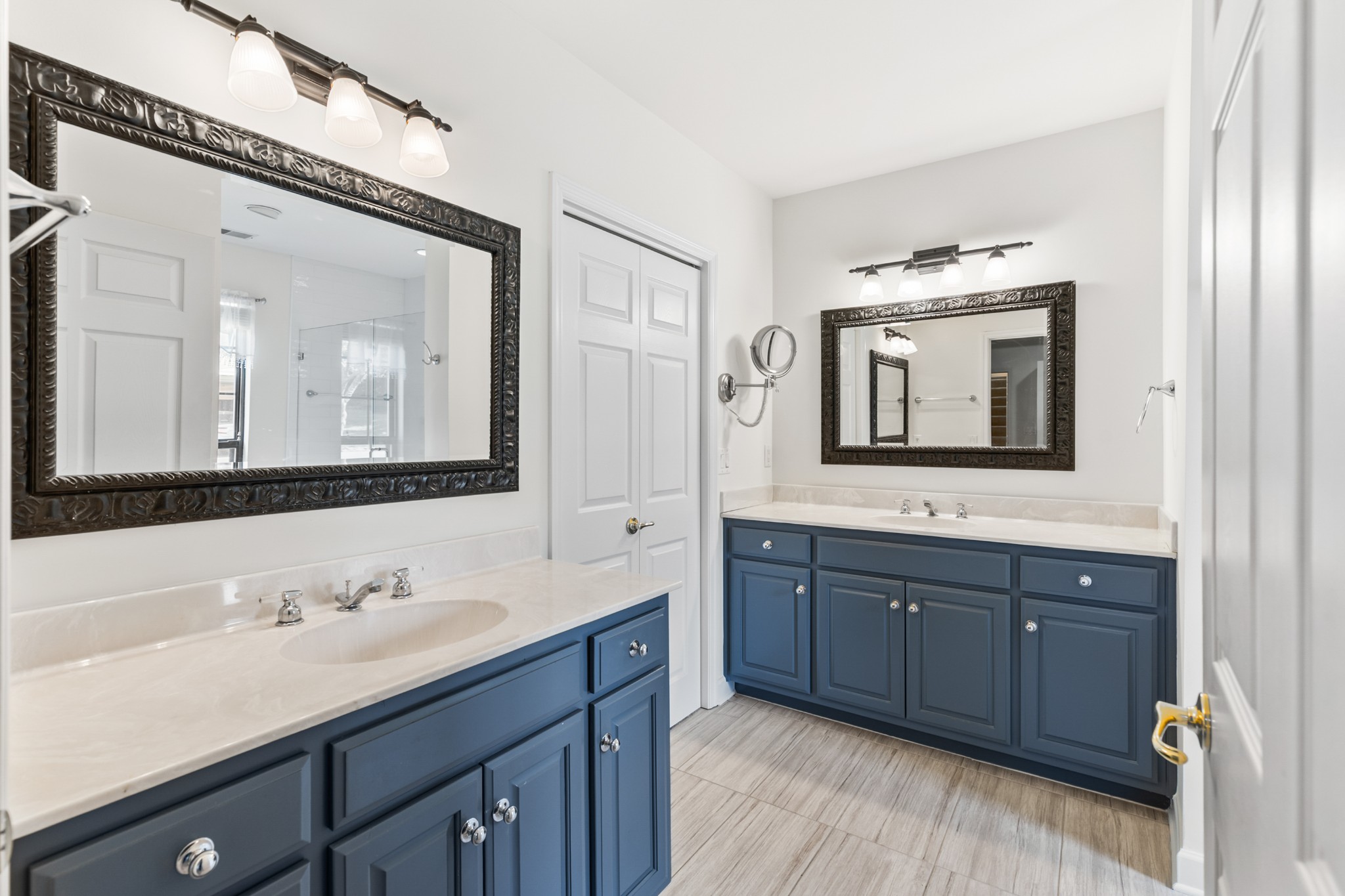 8090 Sunrise Circle Franklin, TN 37067 - Photo 30 of 57 a bathroom with a double vanity sink and mirror with bathtub