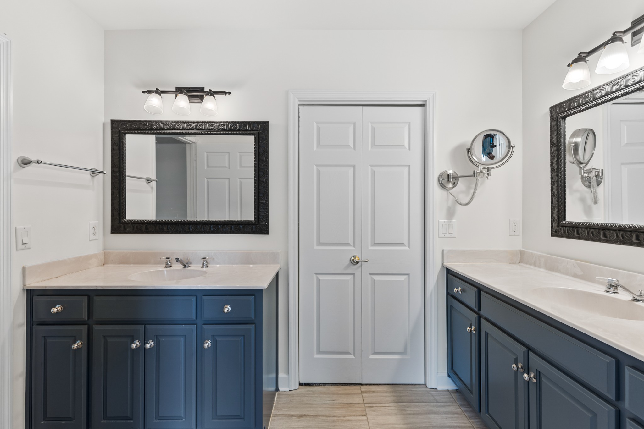 8090 Sunrise Circle Franklin, TN 37067 - Photo 31 of 57 a bathroom with a sink and a mirror