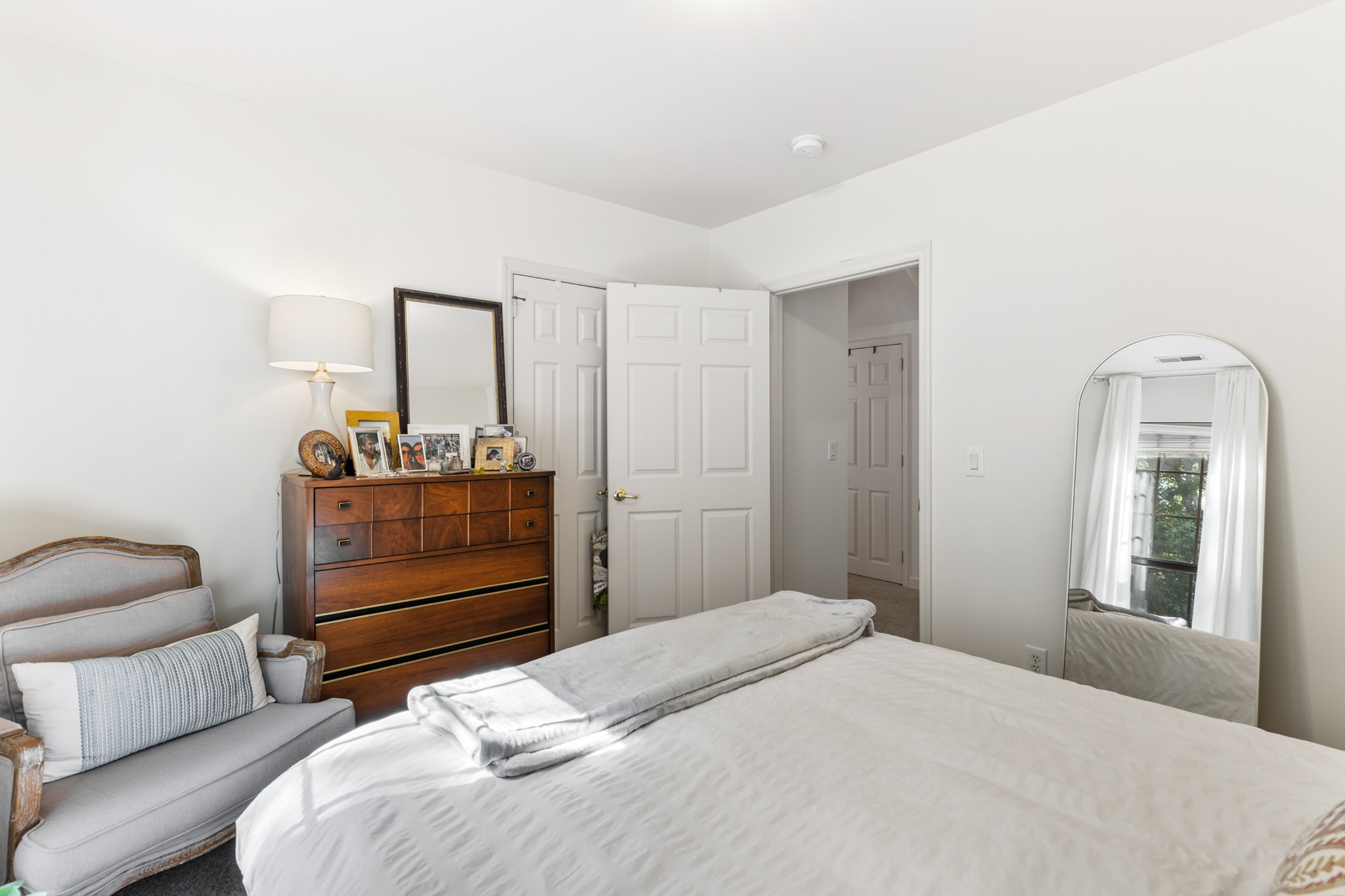 8090 Sunrise Circle Franklin, TN 37067 - Photo 36 of 57 a bedroom with a bed and a mirror