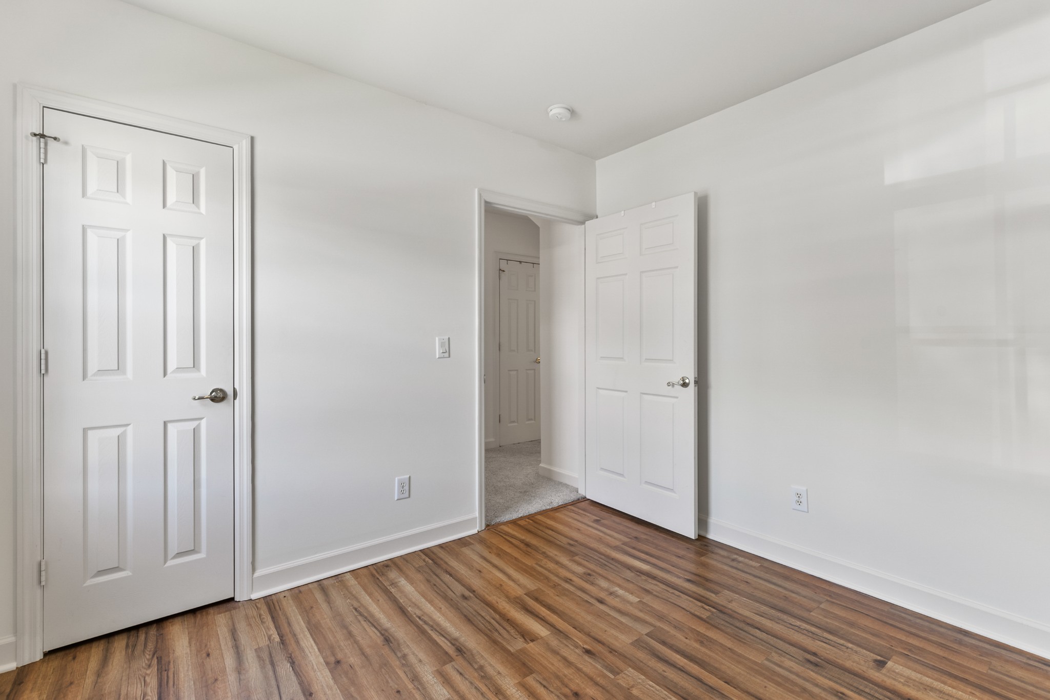 8090 Sunrise Circle Franklin, TN 37067 - Photo 40 of 57 a view of an empty room with wooden floor