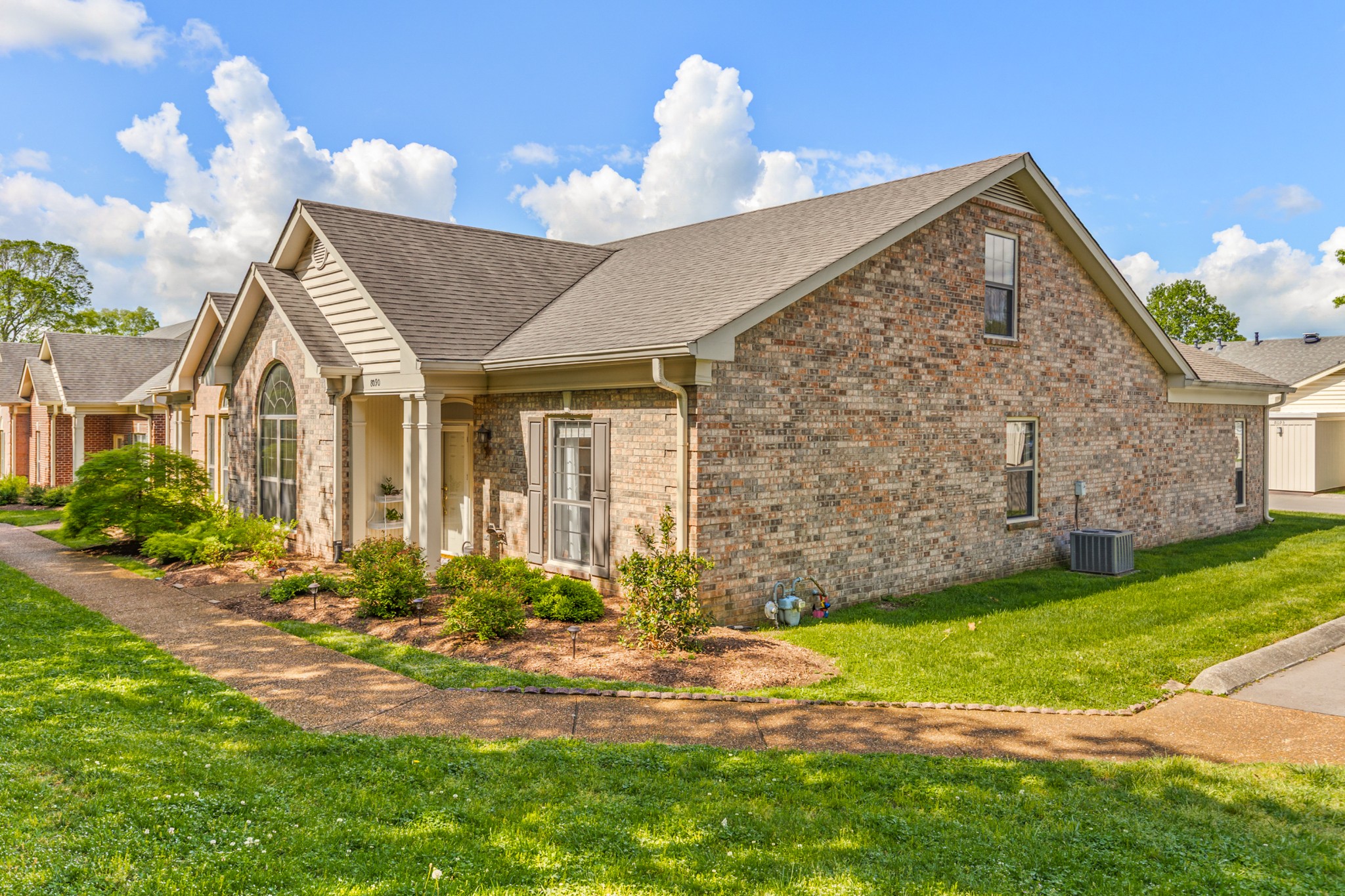 8090 Sunrise Circle Franklin, TN 37067 - Photo 4 of 57 a front view of a house with a yard