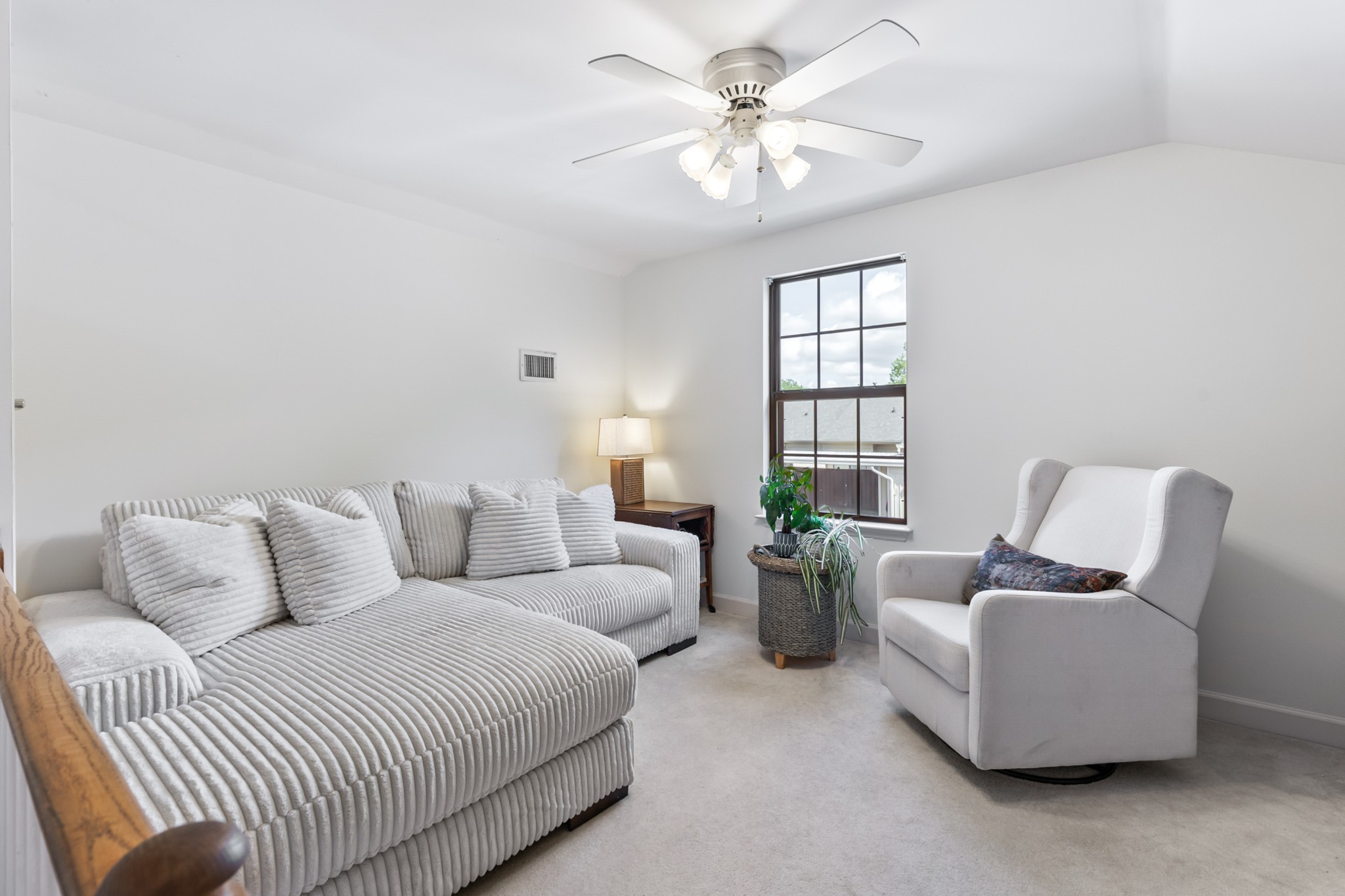 8090 Sunrise Circle Franklin, TN 37067 - Photo 41 of 57 a living room with furniture a chandelier and a window