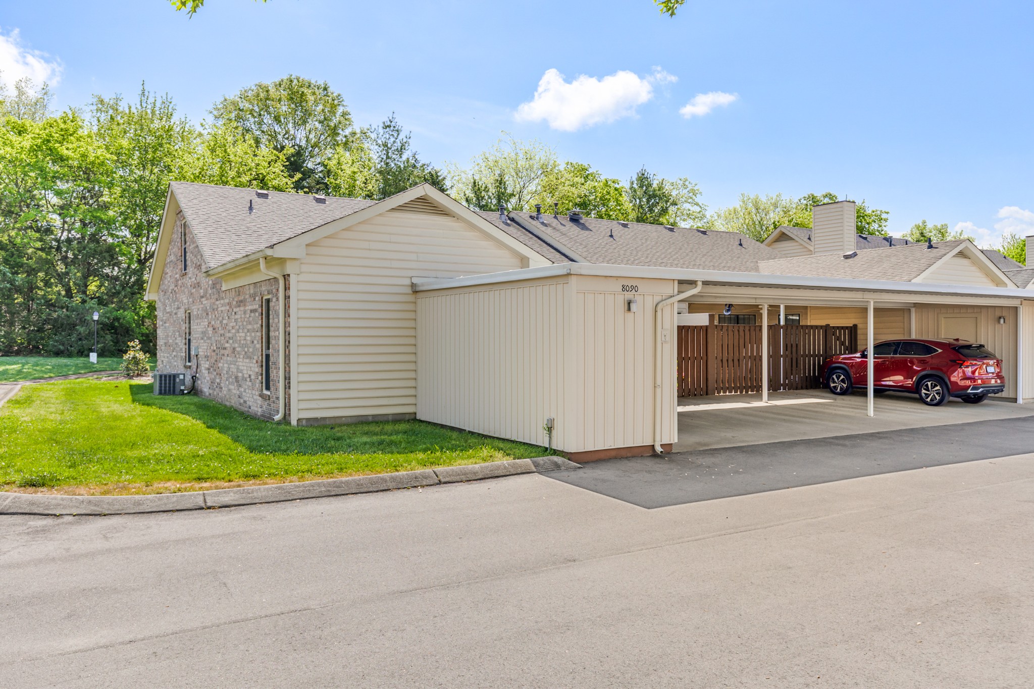 8090 Sunrise Circle Franklin, TN 37067 - Photo 49 of 57 a view of a white house with a yard and plants