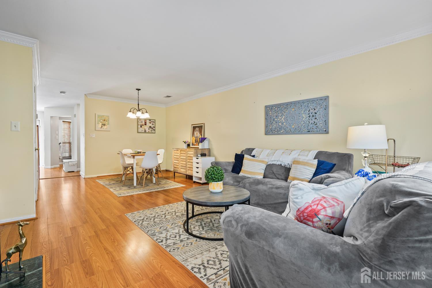 157 Setter Place Freehold, NJ 07728 - Photo 11 of 21 a living room with furniture and a table