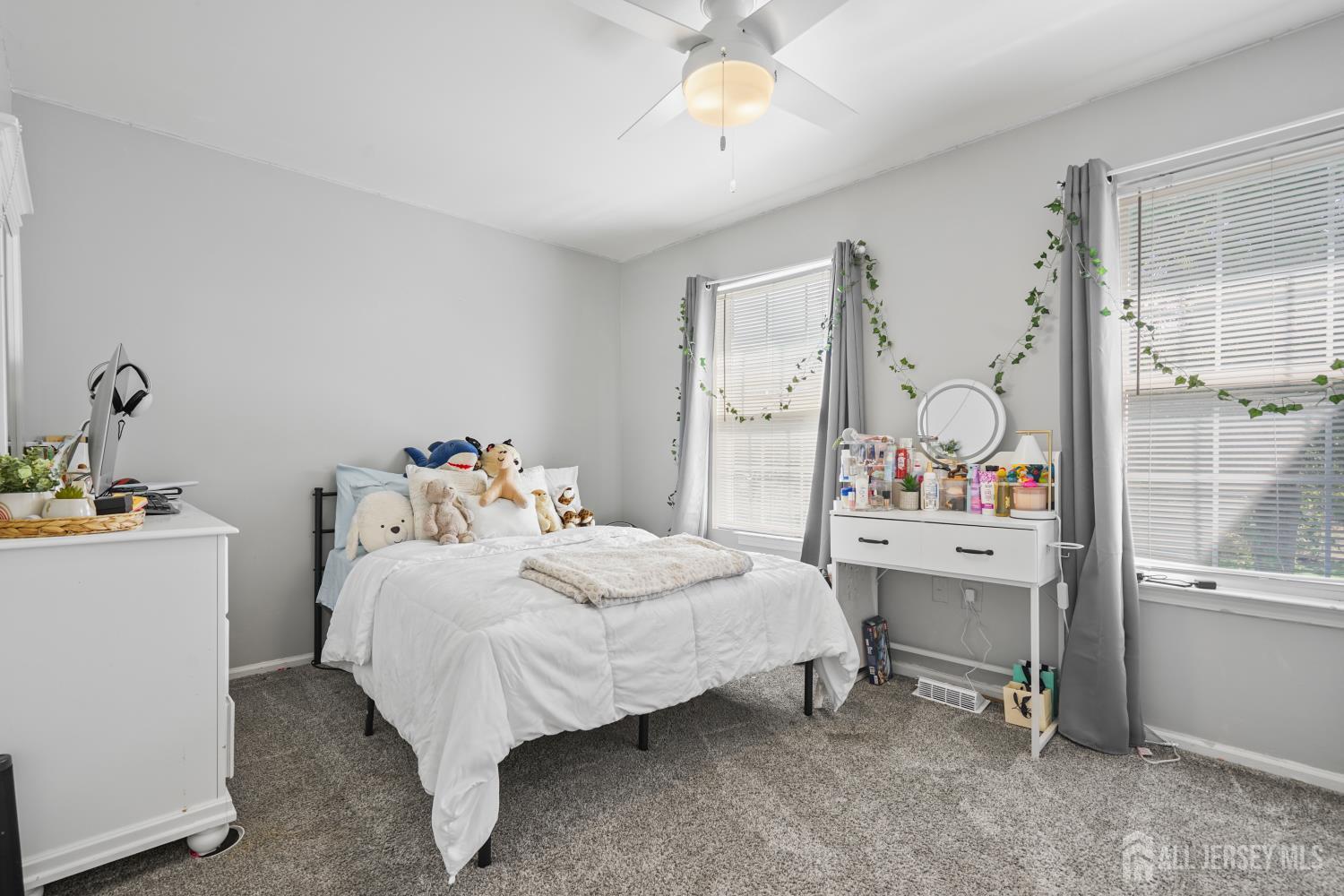 157 Setter Place Freehold, NJ 07728 - Photo 13 of 21 a bedroom with a bed and a table