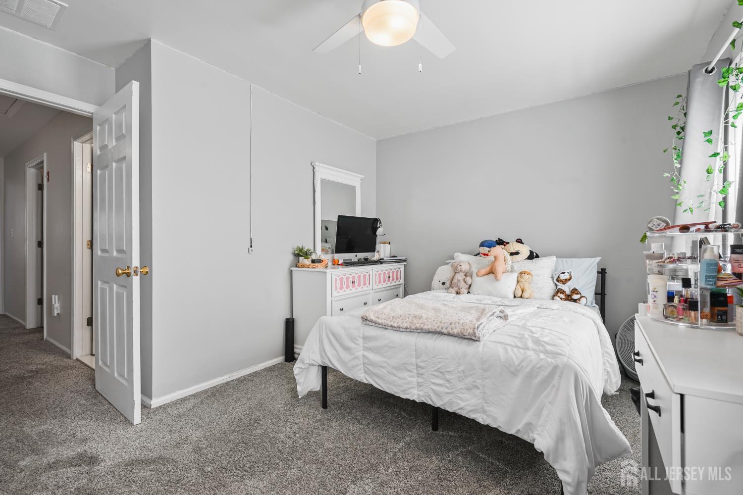 157 Setter Place Freehold, NJ 07728 - Photo 14 of 21 a bedroom with a bed and a window