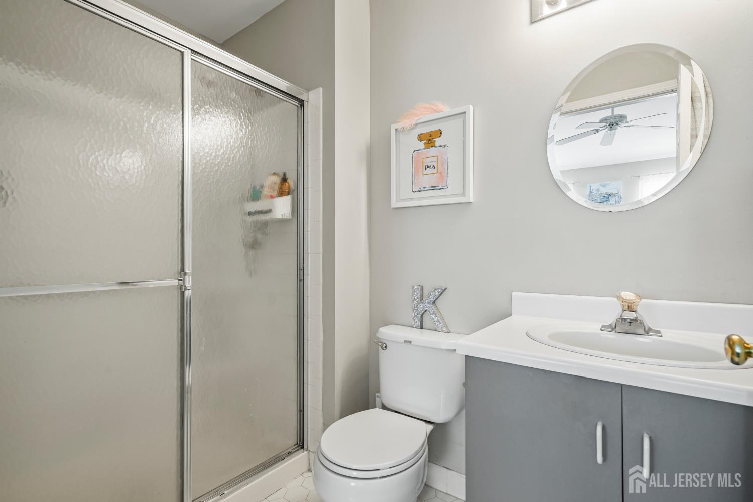 157 Setter Place Freehold, NJ 07728 - Photo 18 of 21 a white toilet sitting next to a bathroom sink