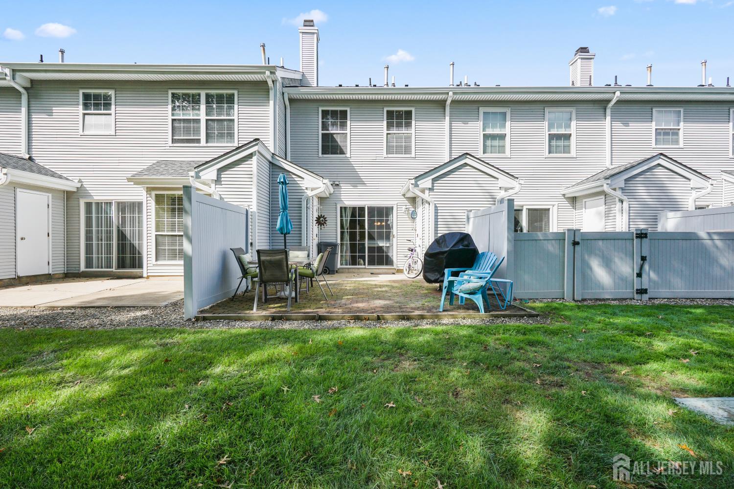 157 Setter Place Freehold, NJ 07728 - Photo 19 of 21 a front view of a house with a yard and porch