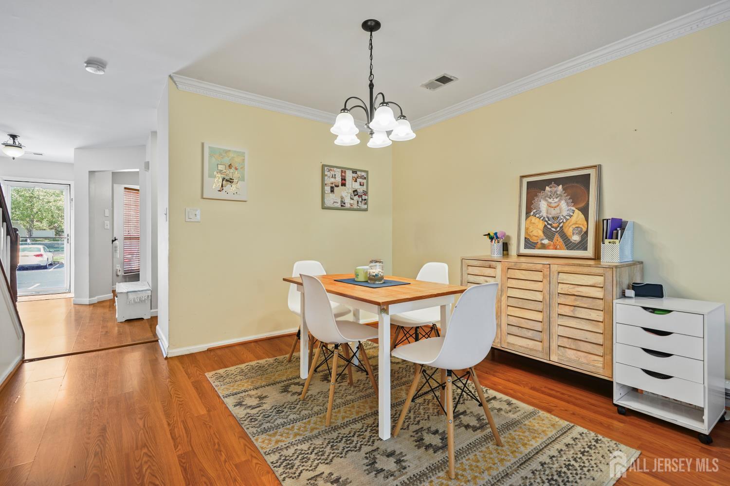 157 Setter Place Freehold, NJ 07728 - Photo 10 of 21 a view of a dining room with furniture and wooden floor