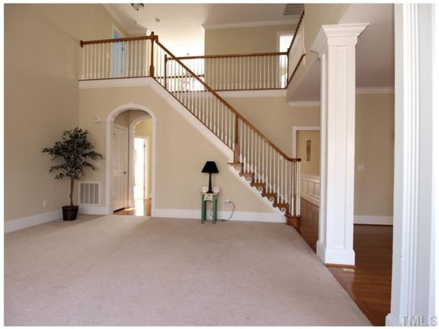 12014 McBride Drive Raleigh, NC 27613 - Photo 10 of 25 Living room/view of stairs-note woodwork/moldings/columns Living Room