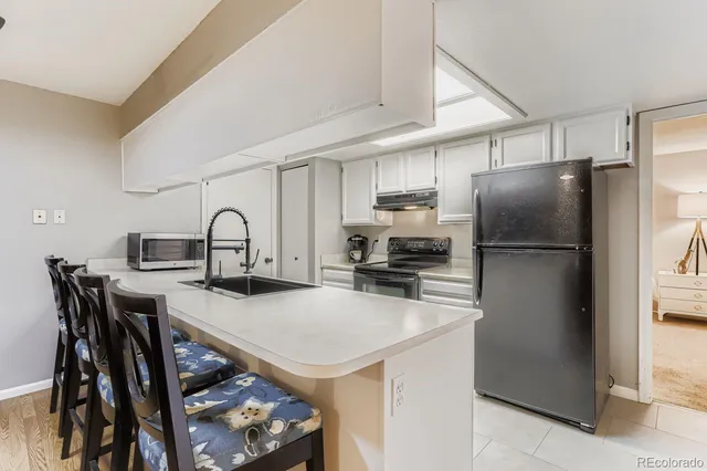 a bed room with a bed and potted plant