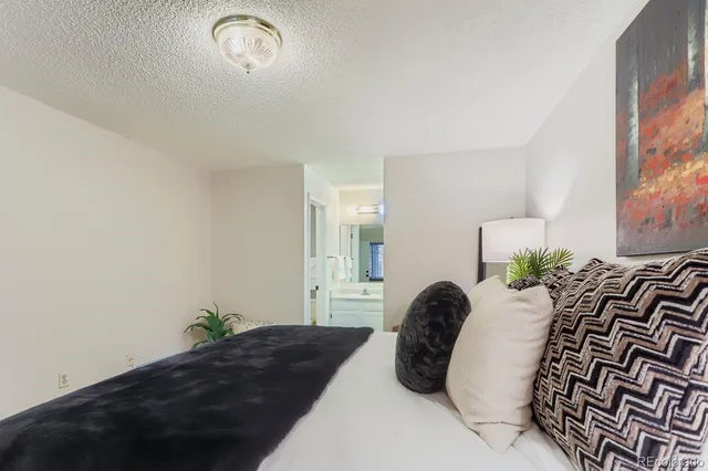 a view of a small house with a yard