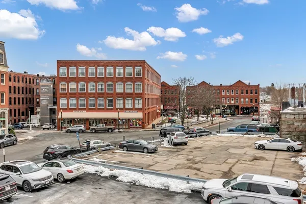 a buildings with car parked in front of it