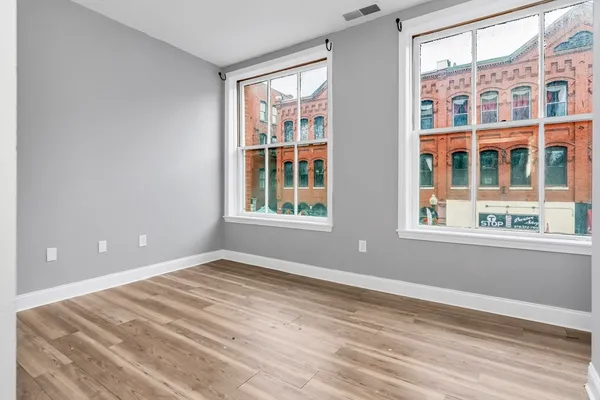 a view of empty room with windows