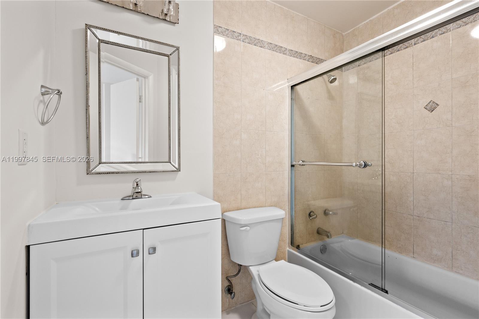 6211 Southwest 138th Court, Unit B Miami, FL 33183 - Photo 16 of 27 a bathroom with a sink toilet and shower