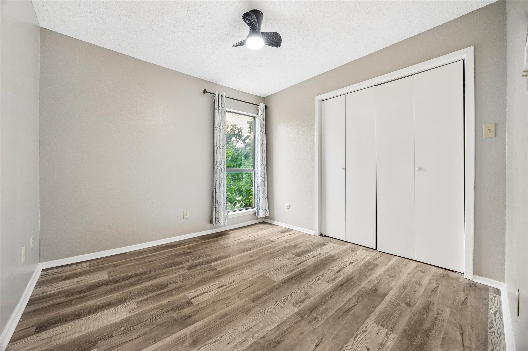 2018 West Rundberg Lane, Unit 13A Austin, TX 78758 - Photo 8 of 11 a view of an empty room with a window